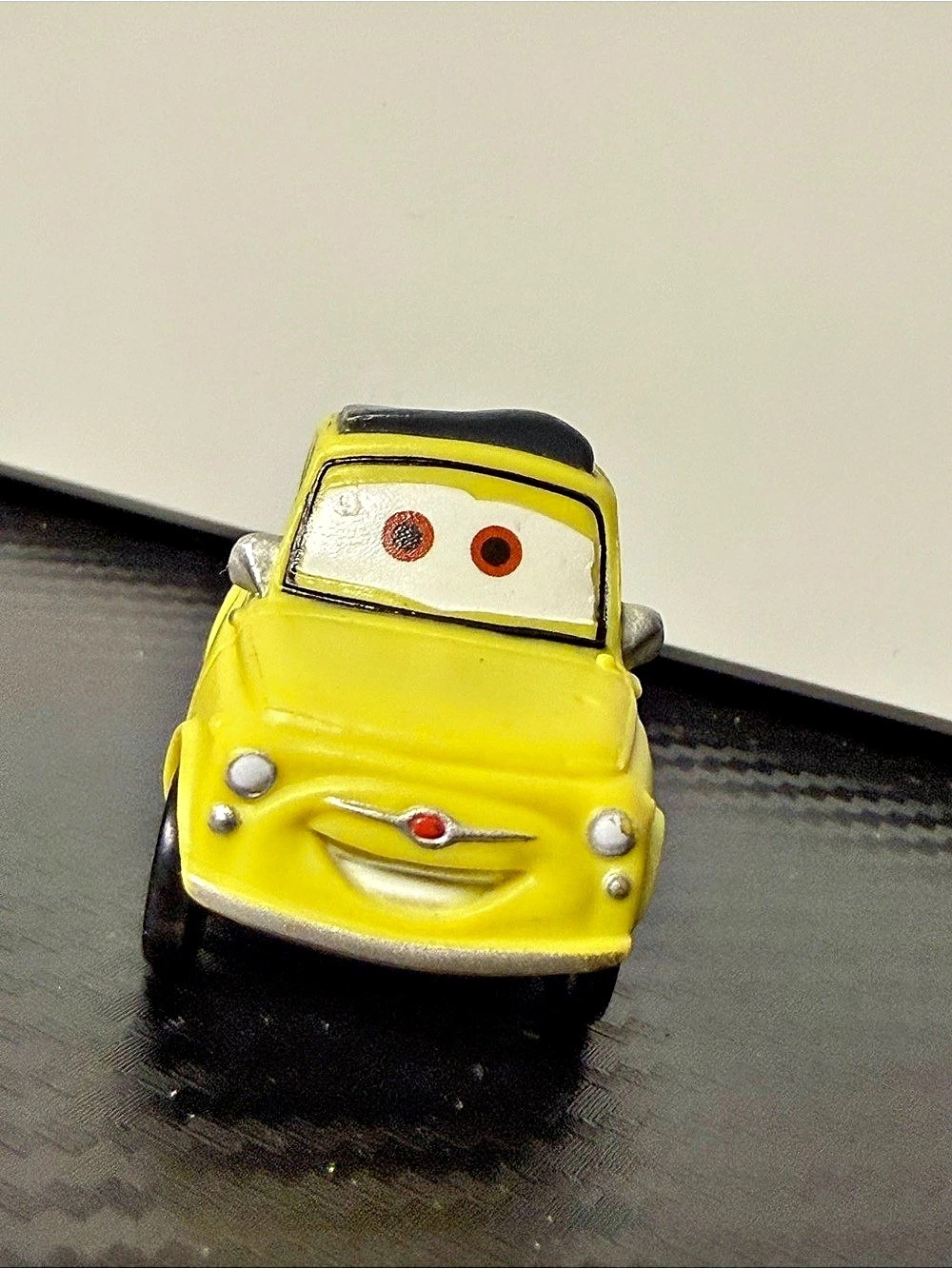 Disney Pixar Luigi Yellow Plastic Toy Car